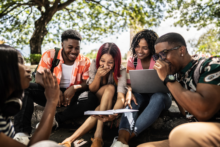 Activities You Can Do With Your Friends To Grow Closer to God - University students having fun while studying outdoors