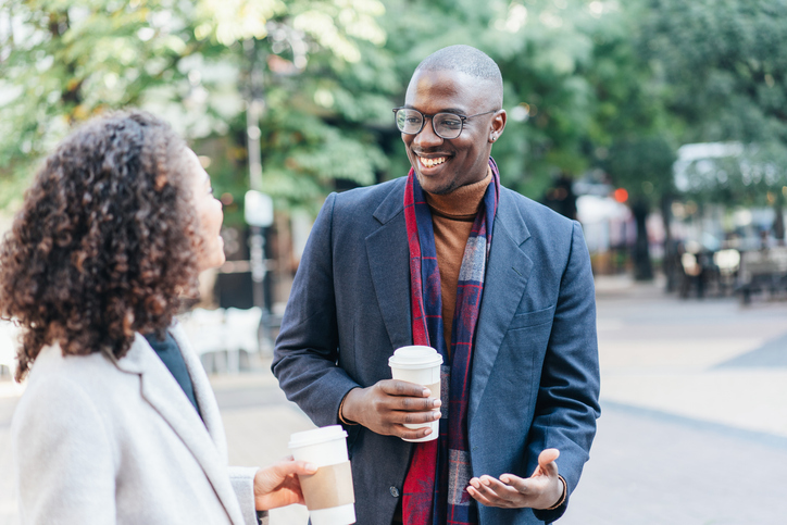 Couple walking and talking outdoor in the city