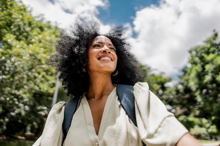 Young woman contemplating outdoors