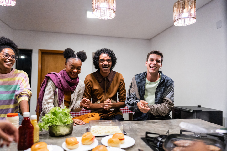game day snacks - Friends talking on hamburger night at home