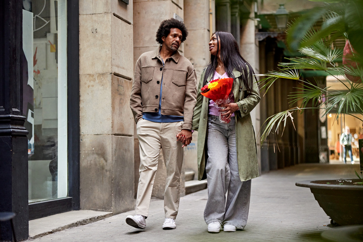 date ideas to get to know someone - Mature man and woman enjoying weekend leisure in the city