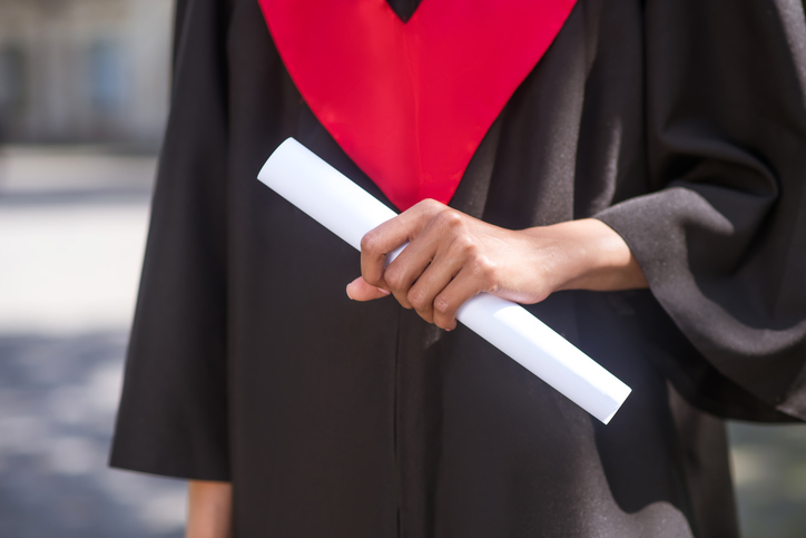A female student feeling awesome about college graduation