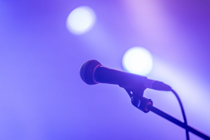 Christian Battle Rap - Microphone on stage with fog and lights in the background
