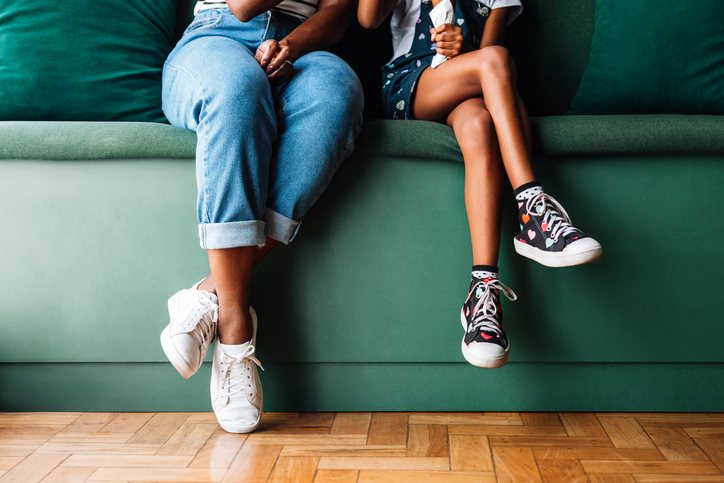 is sitting too long dangerous - Parent and daughter sitting together