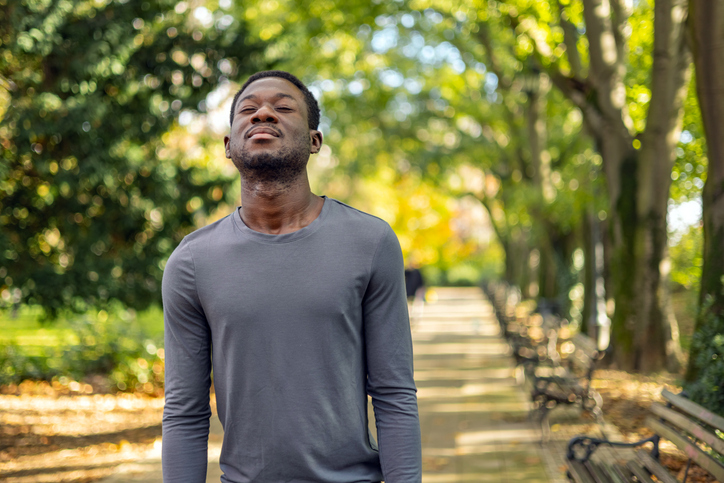 Calm Man Outdoors Relaxing And Breathing In Deeply In Autumn Park
