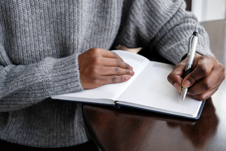Tips For Left-Handed People - Woman Writes in Journal