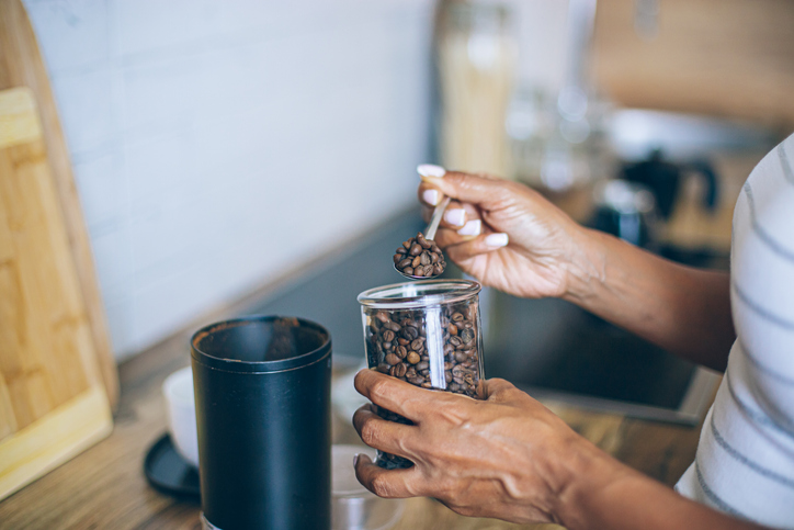 Grinding coffee beans in a coffee grinder