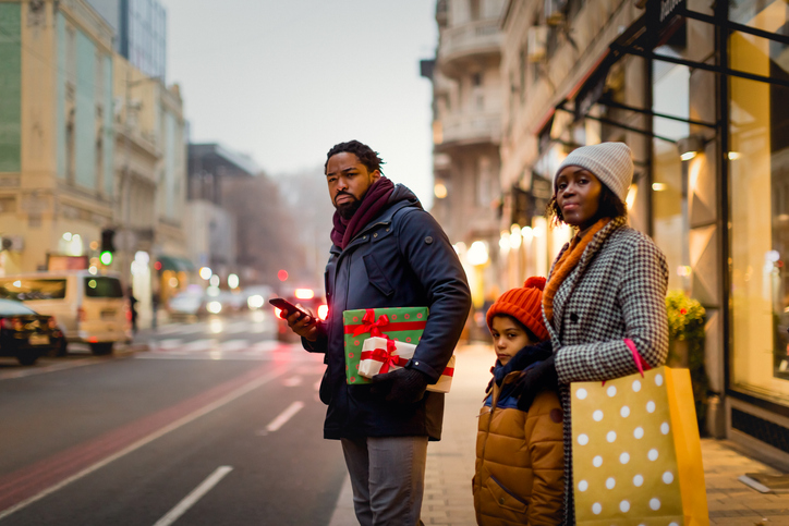 Holiday Budget Hacks - Family Shopping on a Winter Evening in the City