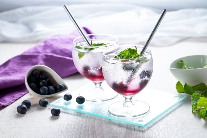 mocktail recipes sober october - refreshing cocktail with blueberry, ice and mint, selective focus