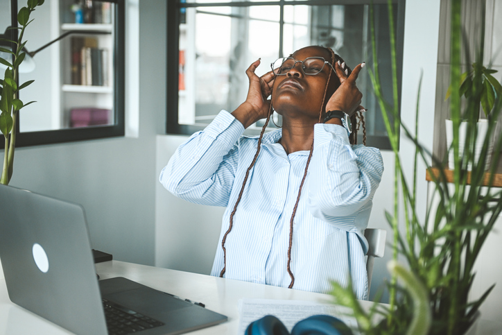 tips for managing depression during fall - young woman tired at work