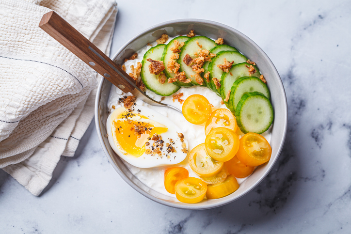 Savory cottage cheese bowl with egg, tomatoes and cucumber.