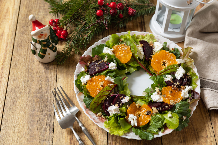festive holiday recipes thanksgiving christmas - Christmas appetizer New year meal idea. Christmas wreath salad with beetroot, tangerines, feta cheese and pecans on the rustic table.