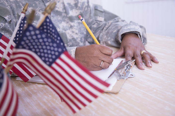 Black Celebrities Who Served in the Military - Female recruiter reviews applications.