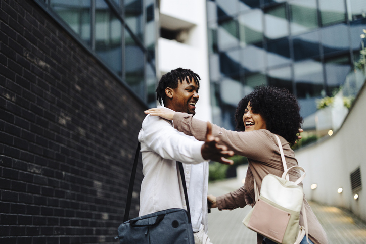 Advent Week 4 Love - Couple of business persons walking together and talking