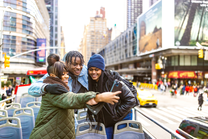 Excited Friends Taking City Selfie on Open-Top Bus - Grieve A Major Life Change
