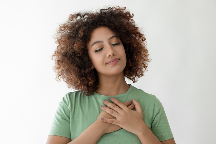 Young woman crossing her hands on her chest