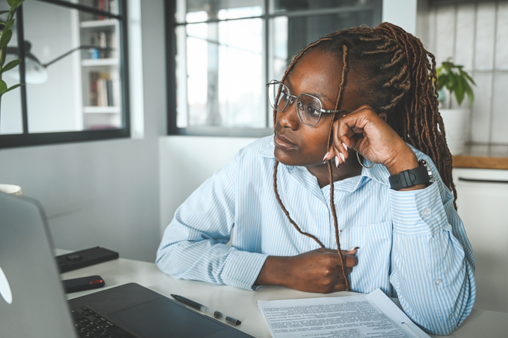 young woman tired at work