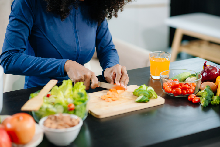 Healthy cooking, featuring fresh fruits, vegetables, and a blender. Perfect for themes of nutrition, wellness