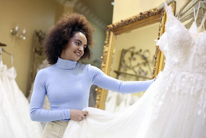 Young woman buying a wedding dress
